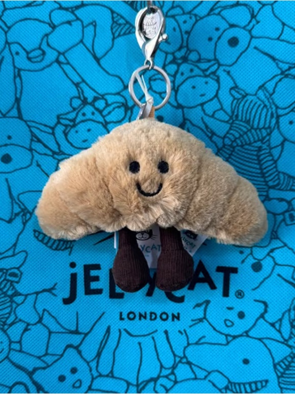 Jellycat Beige Croissant Keychain with Brown Legs